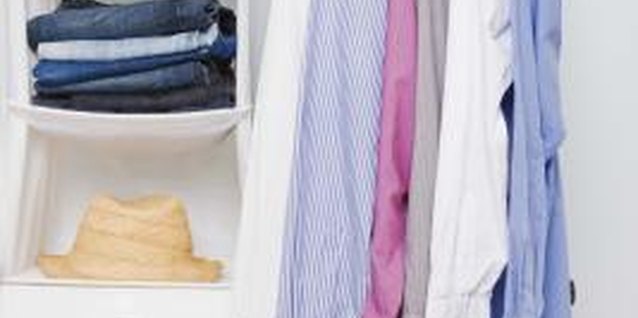 Jupiterimages/Polka Dot/Getty Images A clothing rack tucked into a corner makes a practical closet.