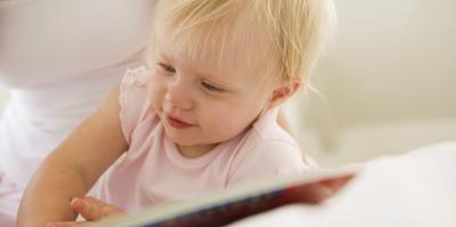 Jupiterimages/Pixland/Getty Images Let your toddler play with books.