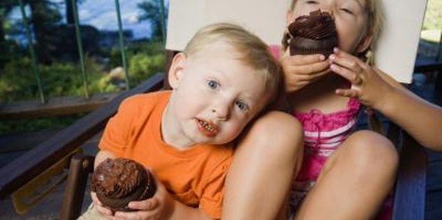 Creatas Images/Creatas/Getty Images Kids happily eat vegetables when they're hidden in chocolate cupcakes.