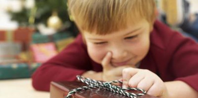 Stockbyte/Stockbyte/Getty Images Opening presents is a favorite activity for children everywhere.