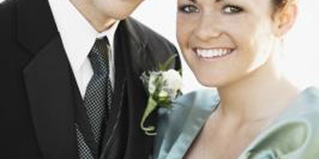 Brand X Pictures/Brand X Pictures/Getty Images Formal attire means a suit for guys and fancy dress for girls.