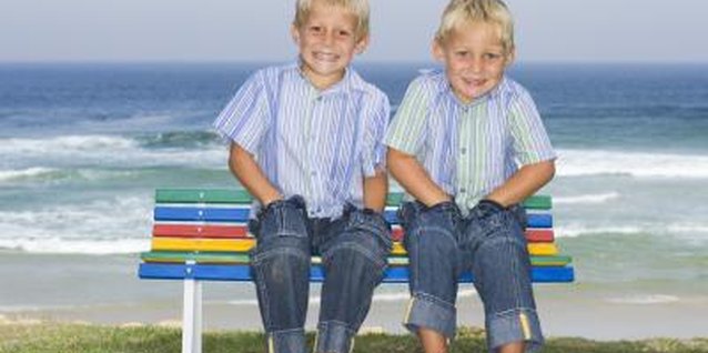 Polka Dot Images/Polka Dot/Getty Images Give twins a sense of personal identity with different haircuts.
