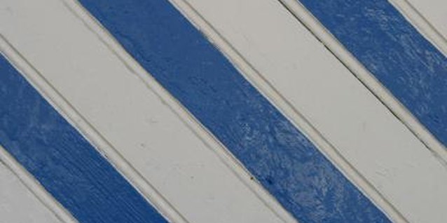 Jupiterimages/Photos.com/Getty Images Painted stripes can make a room look like it has been given a designer makeover.
