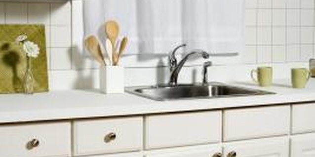 Jupiterimages/Comstock/Getty Images The space below the sink is a false front.