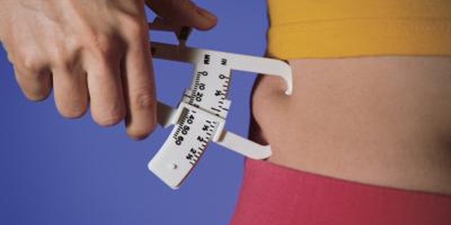 Comstock/Comstock/Getty Images Side fat packs on inches to your waistline and pant size.