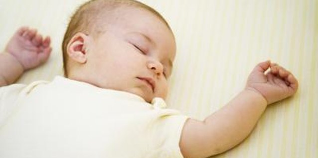 Jupiterimages/Brand X Pictures/Getty Images Sleep training a breastfed baby requires slight modifications.
