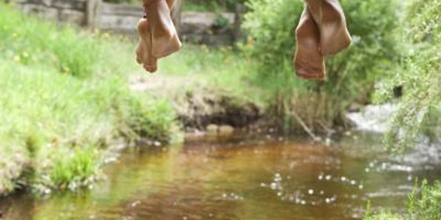 Jupiterimages/BananaStock/Getty Images A stream near your garden provides free, accessible water for plants.