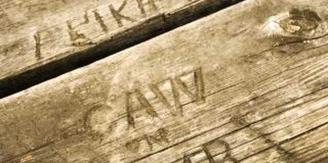 Jupiterimages/Comstock/Getty Images You can sand even deep scratches out of redwood with the right sandpaper.
