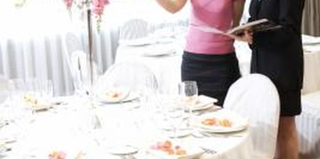 Jupiterimages/Stockbyte/Getty Images A centerpiece riser makes conversation at your table possible.