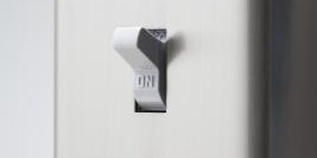 Thinkstock Images/Comstock/Getty Images Paint gives a plain plastic switch cover the look of metal.