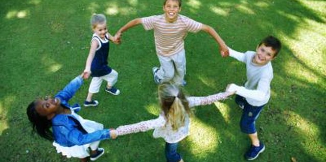 Stockbyte/Stockbyte/Getty Images Teach your child how to interact with her peers.