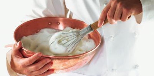 Brand X Pictures/Brand X Pictures/Getty Images Beat heavy cream until it forms firm peaks before filling the pumpkin roll.