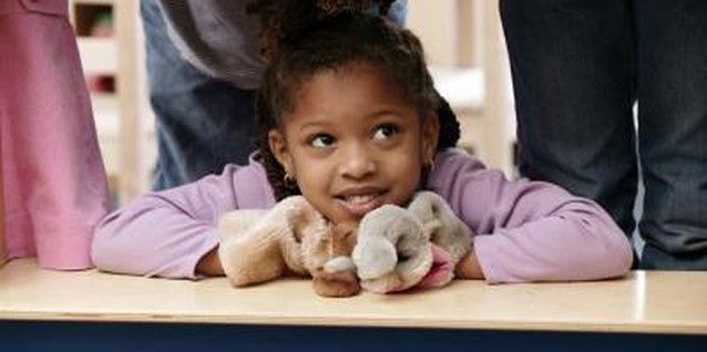 Comstock Images/Comstock/Getty Images Puppets are ideal for dramatic play and refining motor skills.