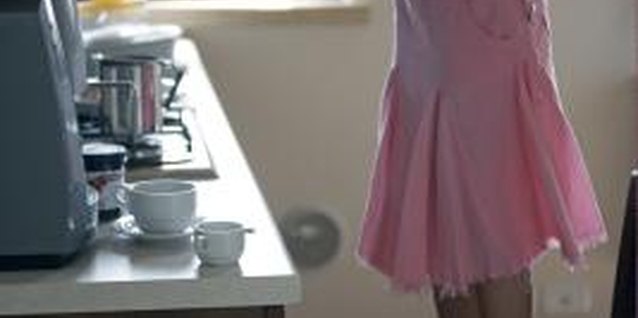 Ableimages/Lifesize/Getty Images Frequent usage takes its toll on your cabinet doors.