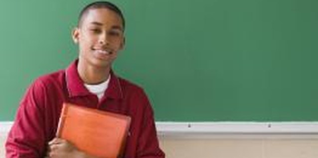 Creatas Images/Creatas/Getty Images Determining why your teen boy isn't doing well in school will help turn things around.