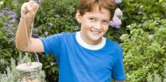Jupiterimages/Pixland/Getty Images Let the kids help you plant the red yucca seeds.