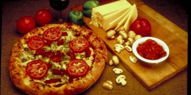 Ablestock.com/AbleStock.com/Getty Images Making a pizza from scratch at home can be a time-consuming but rewarding experience.