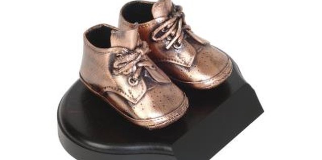 Photos.com/PhotoObjects.net/Getty Images Baby shoes don't have to be strong as bronze to hold up your baby's legs.