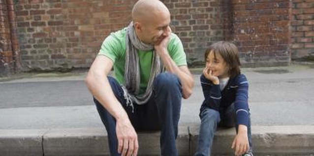 Jupiterimages/Polka Dot/Getty Images Engaging in positive communication with children plays a vital role in their development.