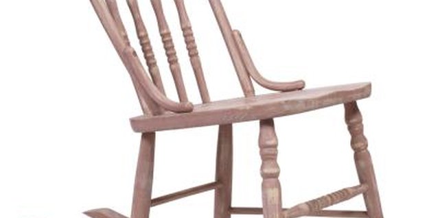 PhotoObjects.net/PhotoObjects.net/Getty Images Furniture with a distressed, pink finish adds originality to a nursery decorated in a trendy pink and brown color scheme.