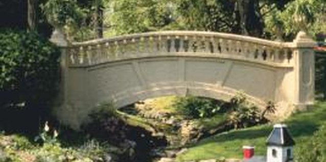 Jupiterimages/Photos.com/Getty Images A babbling brook water feature can become overgrown with algae.