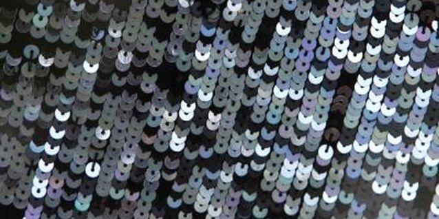 Hemera Technologies/AbleStock.com/Getty Images Sequins are slippery to sew, and should be managed with care.