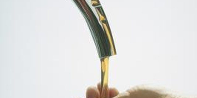 Comstock/Comstock/Getty Images Lubricating the seal on an oil filter provides a tight seal without leaks.