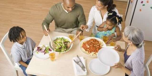 Jupiterimages/Creatas/Getty Images Dinner time gives family a chance to relax and connect with each other.