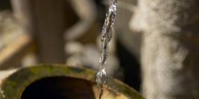 Jupiterimages/Photos.com/Getty Images Preventing algae helps to maintain the beauty of your fountain.