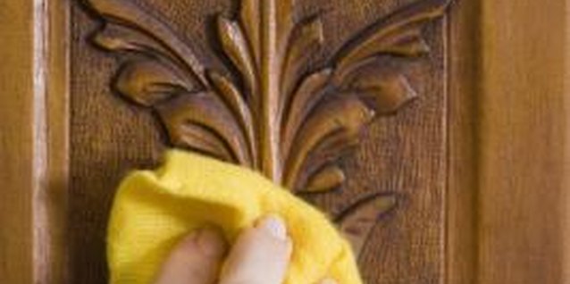 Jupiterimages/Polka Dot/Getty Images Nonabrasive cloths clean without scratching wood finishes.