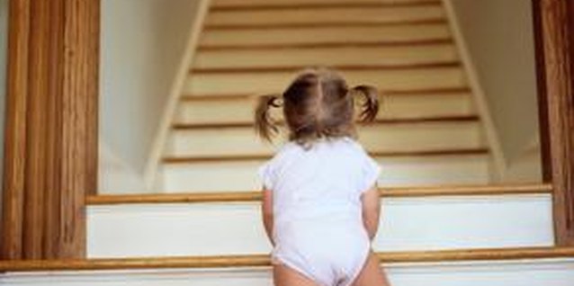 Ryan McVay/Photodisc/Getty Images Keeping kids safe from banister injuries must be a priority.