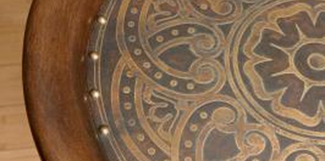 Jupiterimages/Photos.com/Getty Images Leave some open space on your accent table, especially if its surface contains an interesting design.