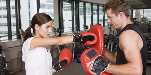 Jupiterimages/Goodshoot/Getty Images Focus mitts help improve punching speed and accuracy.