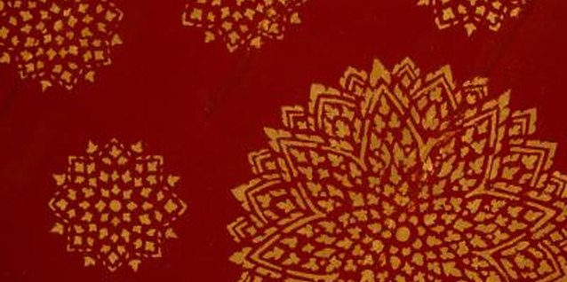 Jupiterimages/Photos.com/Getty Images Doily stencils add drama and life to an otherwise plain wall.