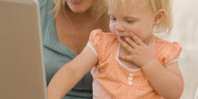 Jupiterimages/Pixland/Getty Images Help your toddler learn about technology through hands-on interaction.
