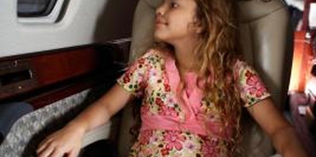 Sam Bassett/Photodisc/Getty Images Wealthy children can become accustomed to being overly pampered.