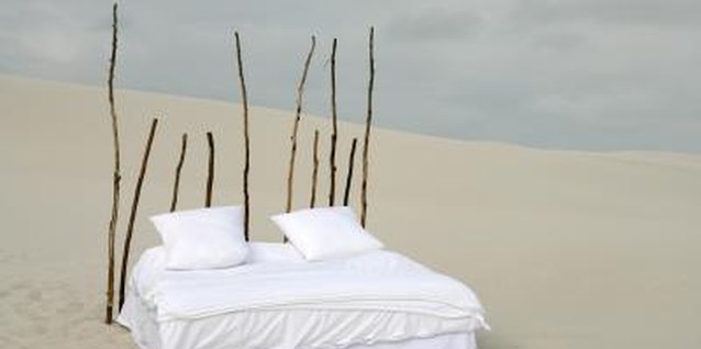 Goodshoot/Goodshoot/Getty Images Even the most rudimentary headboard gives a nice finishing touch to a bed.