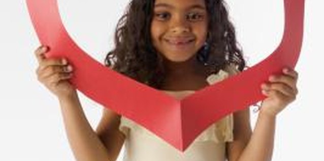 Jupiterimages/liquidlibrary/Getty Images Engage your child in activities to show God's love.