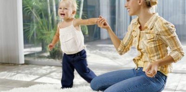 Kraig Scarbinsky/Digital Vision/Getty Images Keep closet doors shut tight from a prying toddler.
