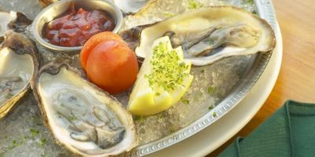 Hemera Technologies/AbleStock.com/Getty Images Eating oysters will help you meet your recommended iron intake.
