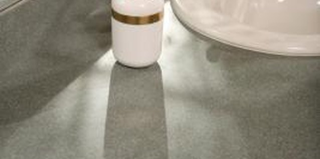 Jupiterimages/Photos.com/Getty Images Add mirror to the backsplash in kitchen or bath.