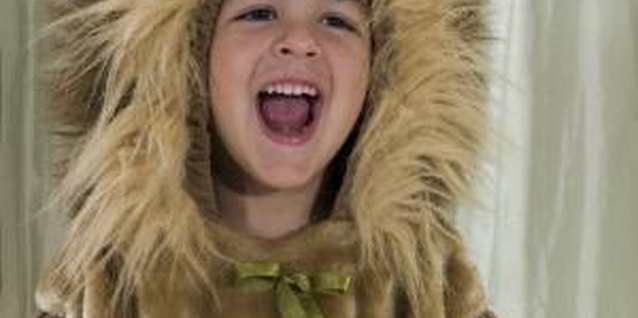 D. Anschutz/Photodisc/Getty Images Embellish a little girl's lion tail with a ribbon bow.