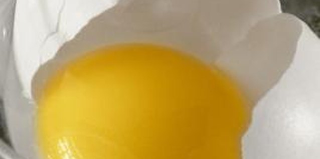 Jupiterimages/liquidlibrary/Getty Images Intact eggshells naturally prevent bacteria from entering and spoiling eggs.