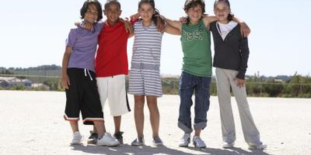 Roger Weber/Digital Vision/Getty Images Preteen boys need peer affirmation.