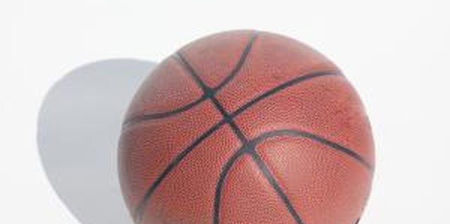 Siri Stafford/Photodisc/Getty Images A deflated basketball serves as base for a sports-themed centerpiece.