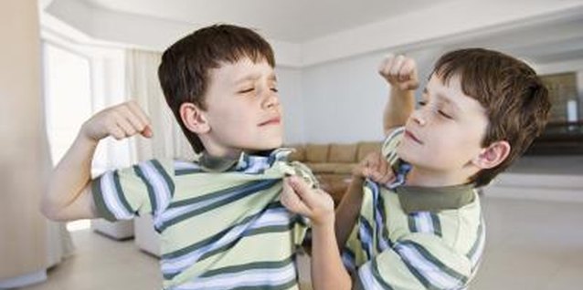 Jupiterimages/Goodshoot/Getty Images Play games to help end the sibling rivalry.