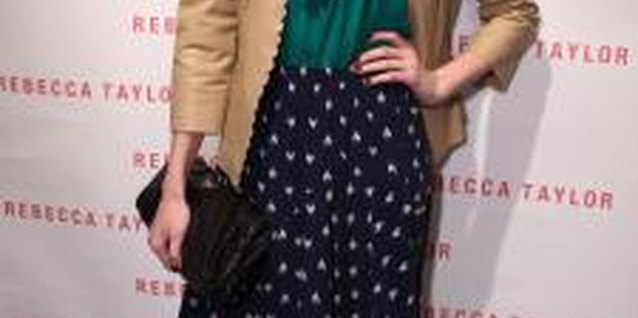 Alexandra Wyman/Getty Images Entertainment/Getty Images Emma Robert sports a blue-dotted skirt at a store opening in Los Angeles.