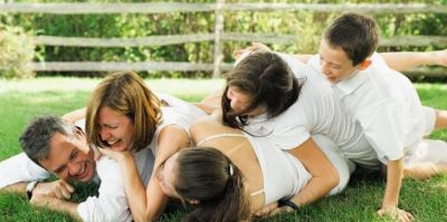 NA/Photos.com/Getty Images Keeping your lawn ready for family play means feeding it right.