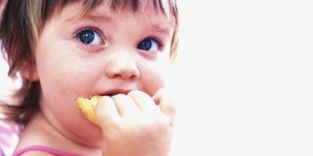 Jupiterimages/liquidlibrary/Getty Images Teach her healthy eating habits when she's young.