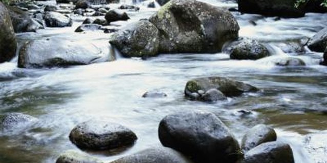 Ryan McVay/Digital Vision/Getty Images River rocks have been rounded and smoothed by river water.